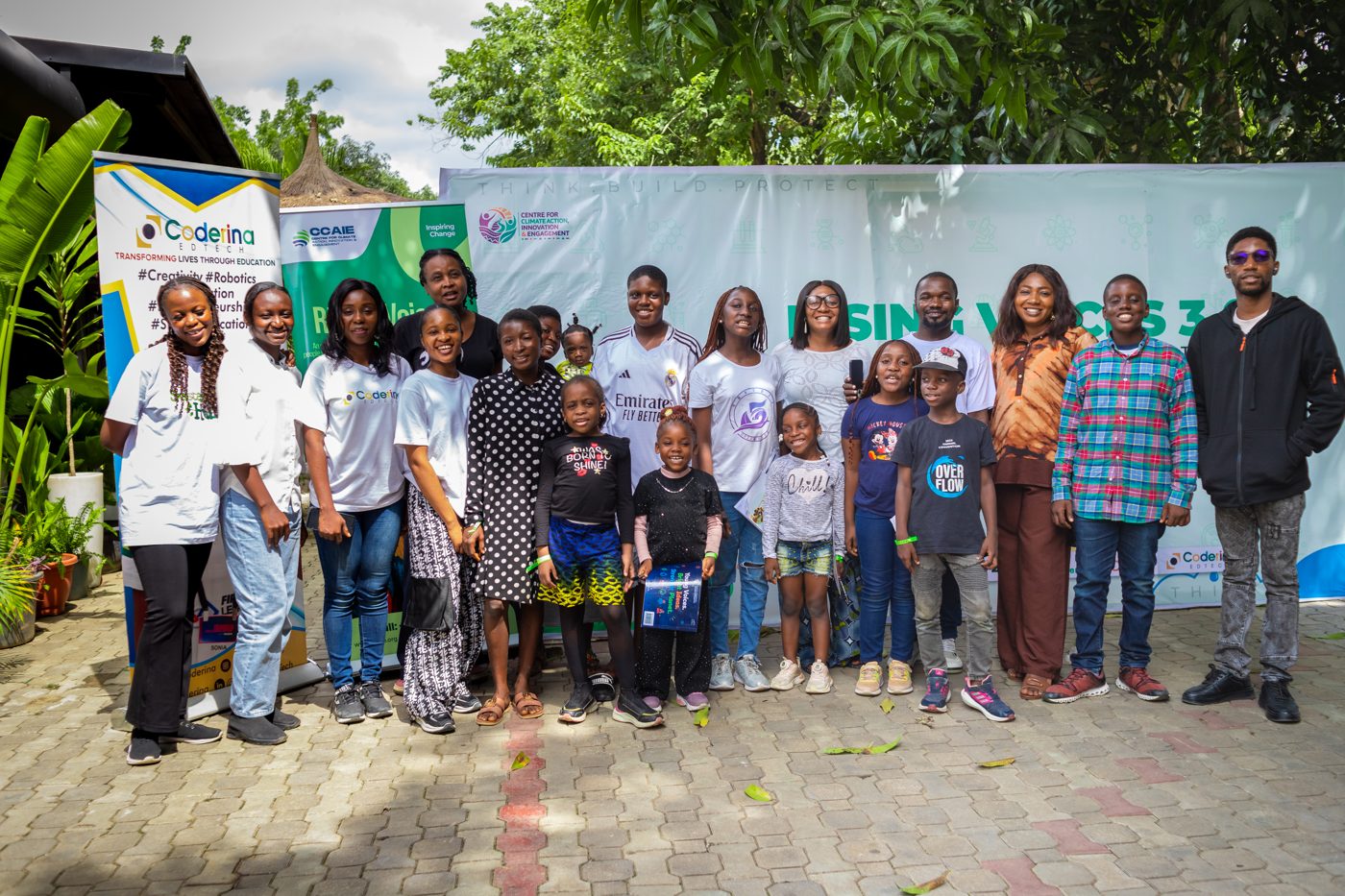 The full Rising Voices cohort and facilitators outside the venue in Abuja