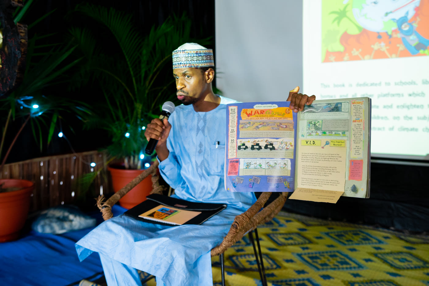 A CCAIE facilitator presenting climate readiness findings from printed evidence boards to an audience