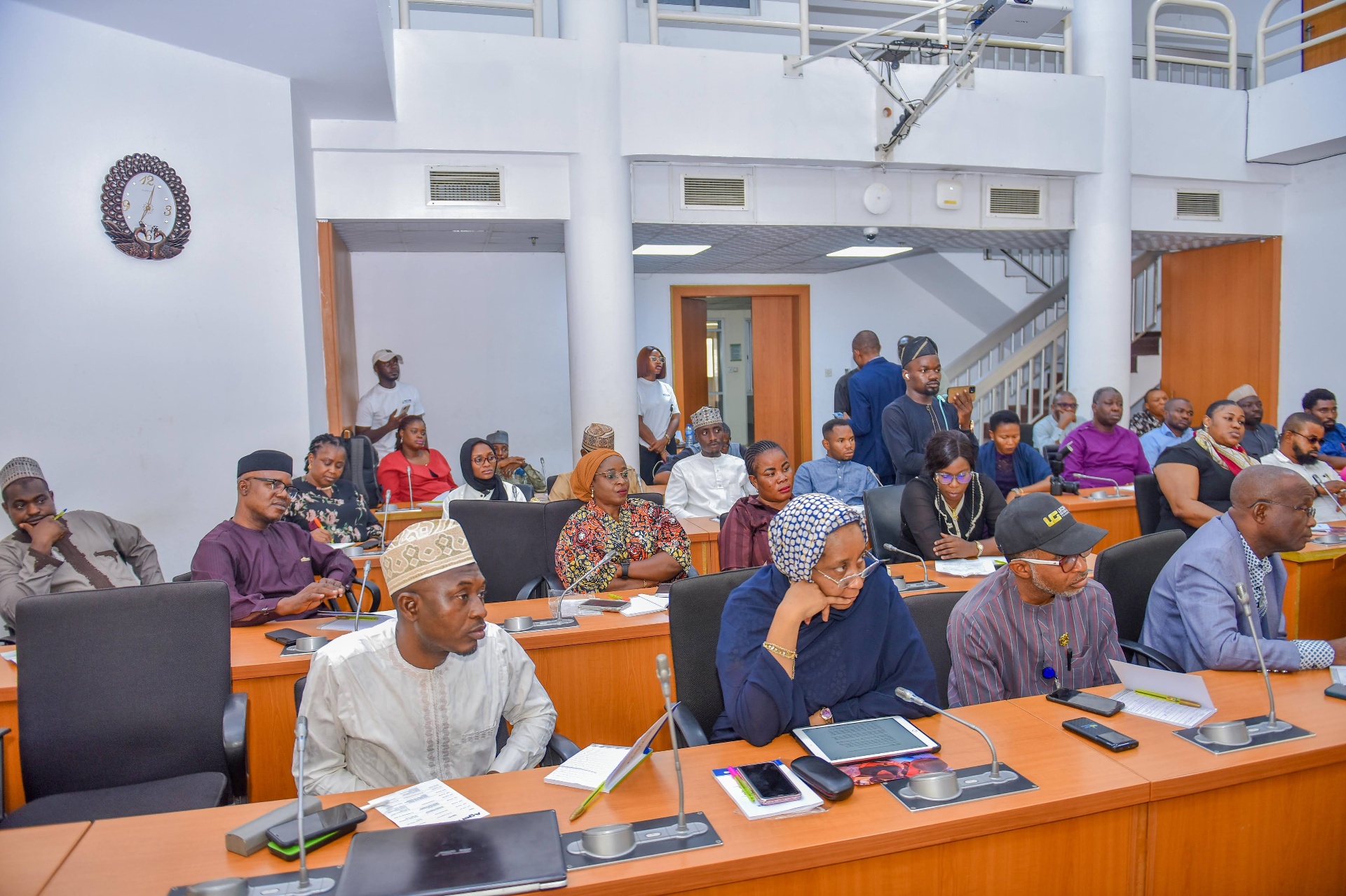 Participants listening during a CCAIE climate dialogue in a conference room